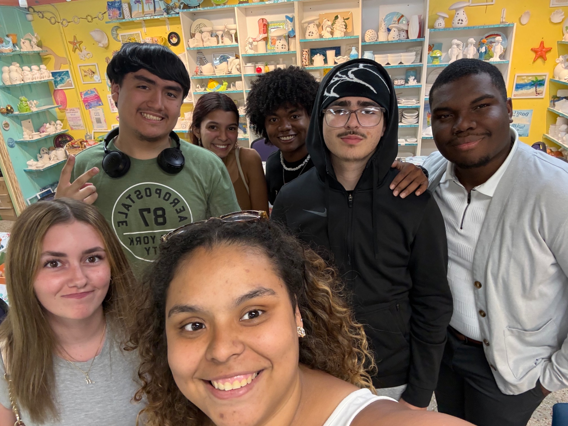 Teens smiling together during an Uncommon Thursdays night