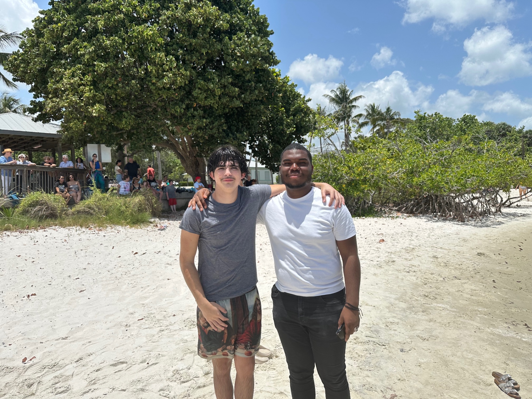 Two students at the beach after a baptism service