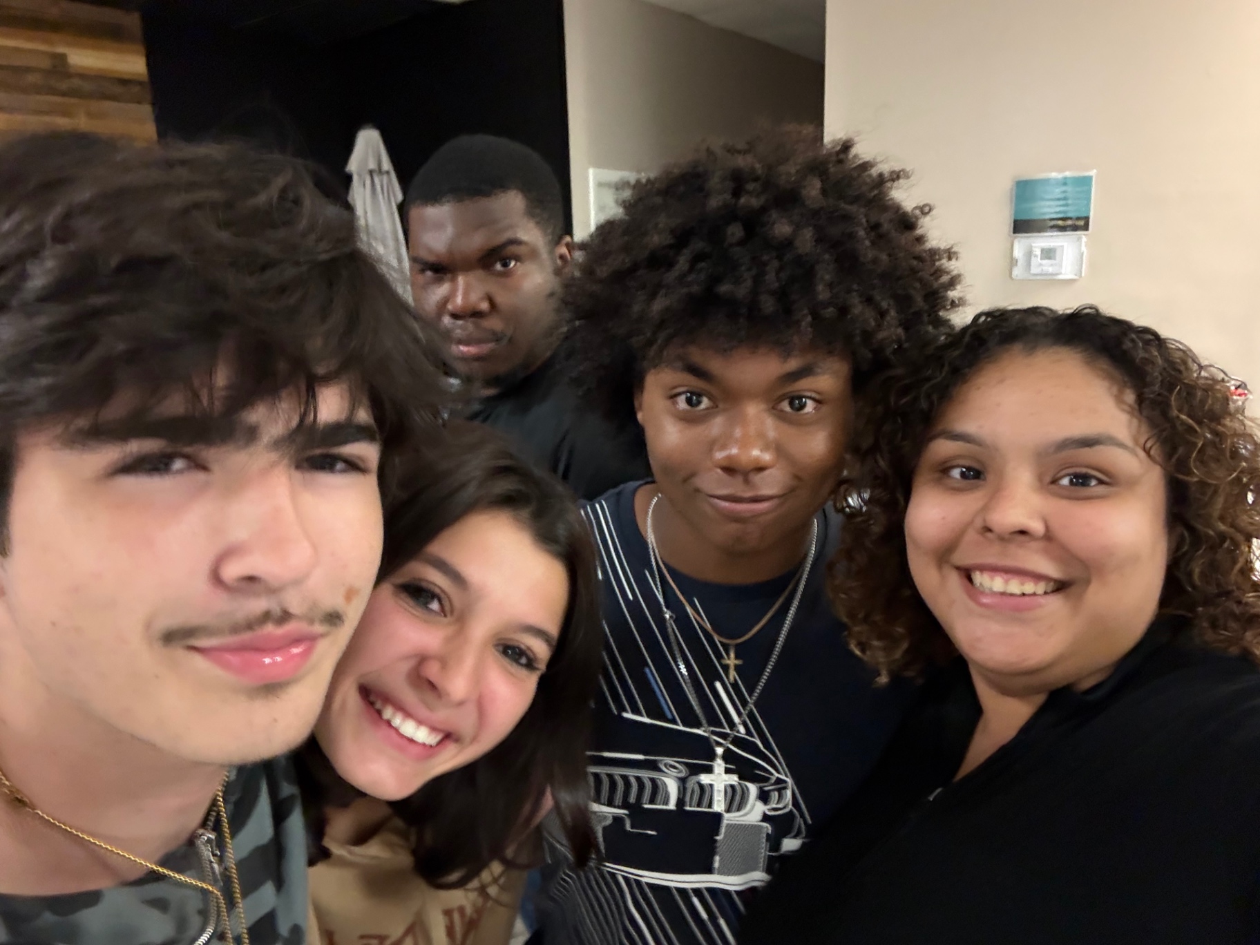 A close-up selfie of five students after a gathering