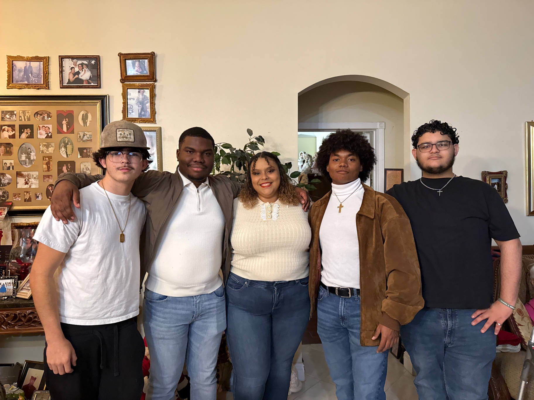 Students and a leader gathered together at a holiday dinner